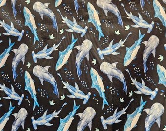 New sharks design print on best quality of nylon spandex fabric sold by yard. 60" wide