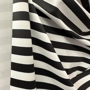 Black and white stripes half inch 4 way stretch nylon spandex. Sold by the yard  60” wide fabric ship from Los Angeles CA USA