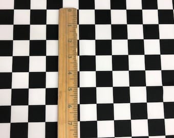 Black/white Chequers design 1” print on nylon spandex 4 way 60” wide Sold by the YD. Ships Worldwide from Los Angeles California USA.