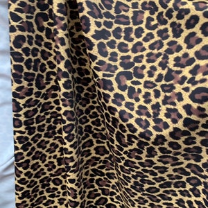 Cheetah print on nylon spandex fabric 4 way Stretch. Sold by the yard. Animal print( leopard print)