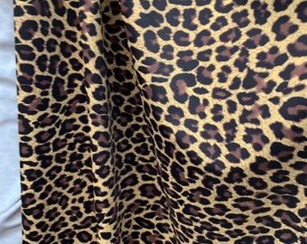 Cheetah print on nylon spandex fabric 4 way Stretch. Sold by the yard. Animal print( leopard print)