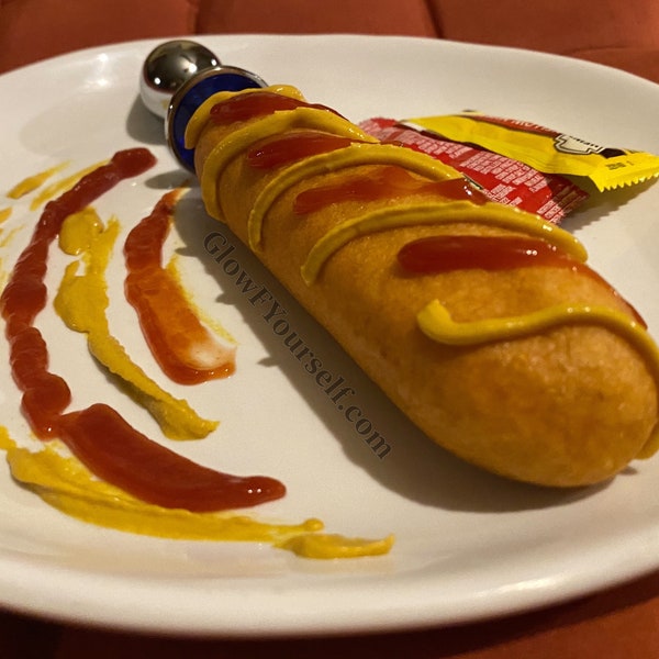 Corn dog with a fancy handle! The Forbidden Glizzy, just in time for the fair, a Lana Del Ray concert, family gathering, mature adults only