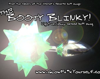 It’s The Booty Blinky! An LED remote control, jelly spiked butt plug! In steel or silicone, for mature adults only rave plur party festival