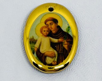 Vintage religious Saint Anthony of Padua pendant, limoge pendant, gold tone celluloid pendant with polished black back