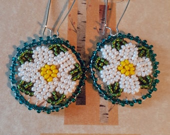 Beaded Birch Bark Earrings - White flowers (daisy-like) with teal edge beading and green leaves, yellow center.