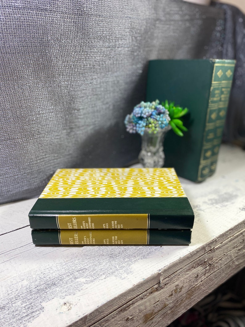 May include: Two small, hardback books with green covers and yellow patterned spines. The spines have the text "Jest Est Eller Ellers" and "Bader's Readers Gest Doks".