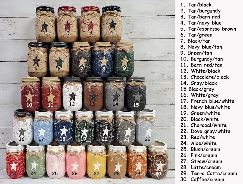 May include: Thirty mason jars painted in various two-tone color combinations. Each jar has a distressed finish and a star design. The jars are numbered 1 through 30 and the color combinations are listed next to the numbers.