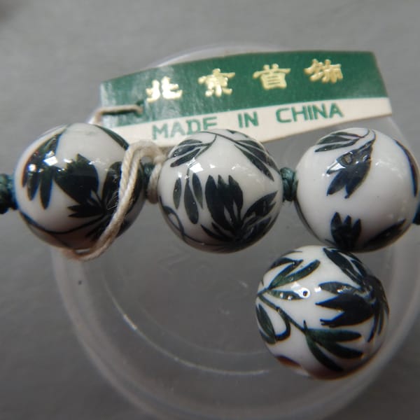 Chinese porcelain beads white with black leaves round  DS 2064