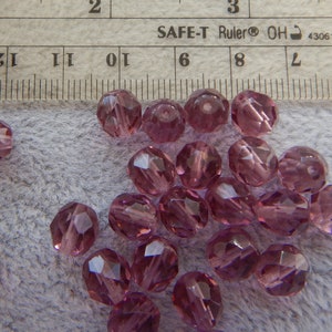 Clear purple faceted rounds  DS 974