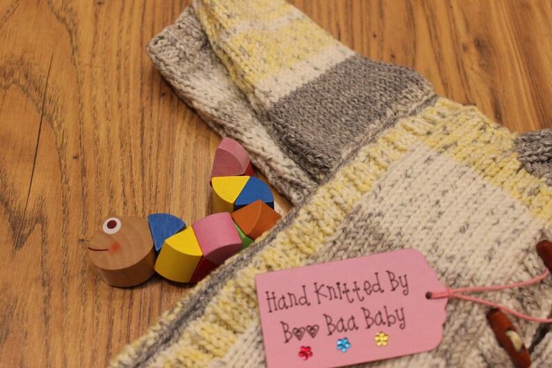 Infants hand knitted coat and hat toggles yellows and greys hand made girls jacket with matching hat cosy knit cardigan set 18-24 months