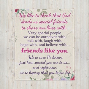 May include: A white throw blanket with a floral design and a pink and purple quote that reads: "We like to think that God sends us special friends to share our lives with. Very special people we can be ourselves with, talk with, laugh with, hope with, and believe with... friends like you. We're sure He knows just how special you are to us... and right now, we're hoping that you know too."