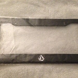May include: Black plastic license plate frame with a white diamond logo in the center.