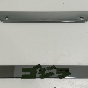g0dzillA Super Hero Lizard Kanji in 3D - Chrome w Army Green Automobile License Plate Frame - Monster