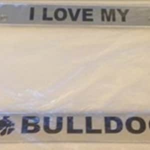 May include: Silver licence plate frame with the text "I Love My Bulldog" in black lettering. The frame has a silver metal finish and a black bulldog silhouette.