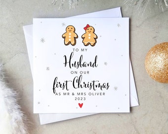 May include: A white Christmas card with the message "TO MY Husband ON OUR first Christmas AS MR & MRS OLIVER 2023". The card features gingerbread people and snowflakes. A red heart is at the bottom.