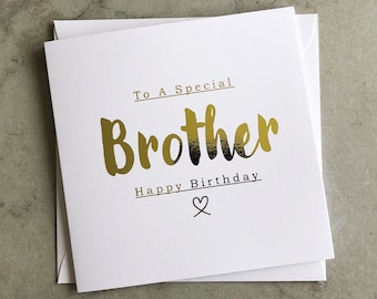 May include: A white card with gold foil lettering that reads "To A Special Brother Happy Birthday" with a small heart symbol.