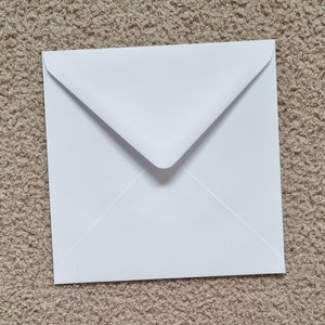 Comes with a white envelope.