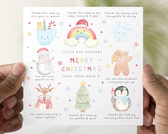 May include: A square Christmas card with watercolor illustrations of festive characters and objects. The card features a snowman, reindeer, penguin, gingerbread man, rainbow, and Christmas tree. Text includes "Merry Christmas" and "Love from Arlo X."