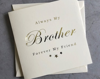 May include: A white card with gold lettering that reads "Always My Brother Forever My Friend" with three gold stars below the text.