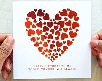 May include: A white card with a red foil heart design. The heart is made up of many smaller hearts. The text on the card reads "Happy Birthday to my Today, Tomorrow & Always".