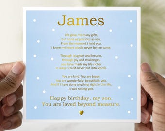 May include: A light blue card with gold lettering that reads "James". The card has a poem about a son and a small gold heart at the bottom. The text reads "Life gave me many gifts, but none as precious as you. From the moment I held you, I knew my heart would never be the same. Through laughter and lessons, through joy and challenges, you have made my life richer in ways I could never put into words. You are kind. You are brave. You are wonderfully, beautifully you. And if I have done anything right in this life, it was raising you. Happy birthday, my son. You are loved beyond measure."