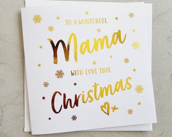 May include: A white Christmas card with gold foil lettering that reads "TO A WONDERFUL Mama WITH LOVE THIS Christmas". The card is decorated with gold snowflakes and stars.