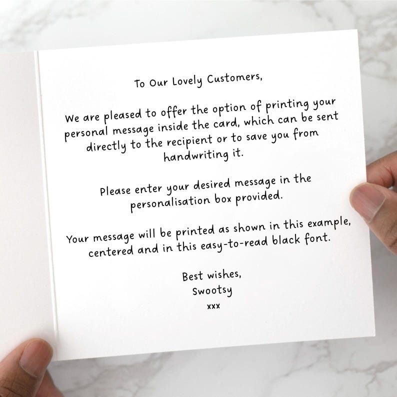 May include: A white greeting card with black text. The text reads: "To Our Lovely Customers, We are pleased to offer the option of printing your personal message inside the card..." The card is held by a person.