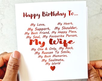 May include: A white card with red foil lettering that reads "Happy Birthday To... My Love, My Heart, My Support, My Shoulder, My Best Friend, My Happy Place, My Soul, My Favourite Person, My Wife, My One & Only, My Rock, My Reason To Smile, My Best Memories, My Soulmate, My World".