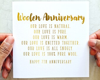 May include: A white card with gold lettering that reads "Woolen Anniversary" and a poem about love being natural, pure, warm, knitted together, snugly, and 100% pure wool. The card also says "Happy 7th Anniversary".