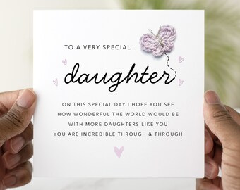 May include: A white card with a pink butterfly illustration and the text "To a very special daughter. On this special day I hope you see how wonderful the world would be with more daughters like you. You are incredible through & through."