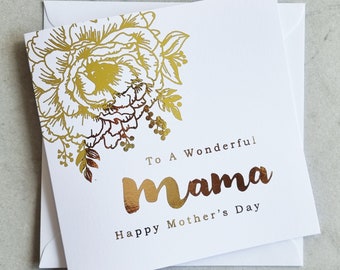 Può includere: Un biglietto bianco per la festa della mamma con un design floreale dorato e le parole "To A Wonderful Mama" e "Happy Mother's Day". Include una busta bianca.