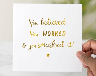 May include: A white card with gold foil lettering that reads "You believed. You worked. & you smashed it!" with a gold star below the text.