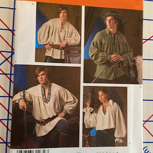 May include: Simplicity sewing pattern 3519 for shirts in sizes XS, S, M, L, XL. The envelope features four variations of long-sleeved shirts with gathered details, including a beige shirt with a patterned neckline, a green shirt with a lace-up front, and white shirts.