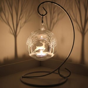 White Raindeer  in the forest hanging small glass