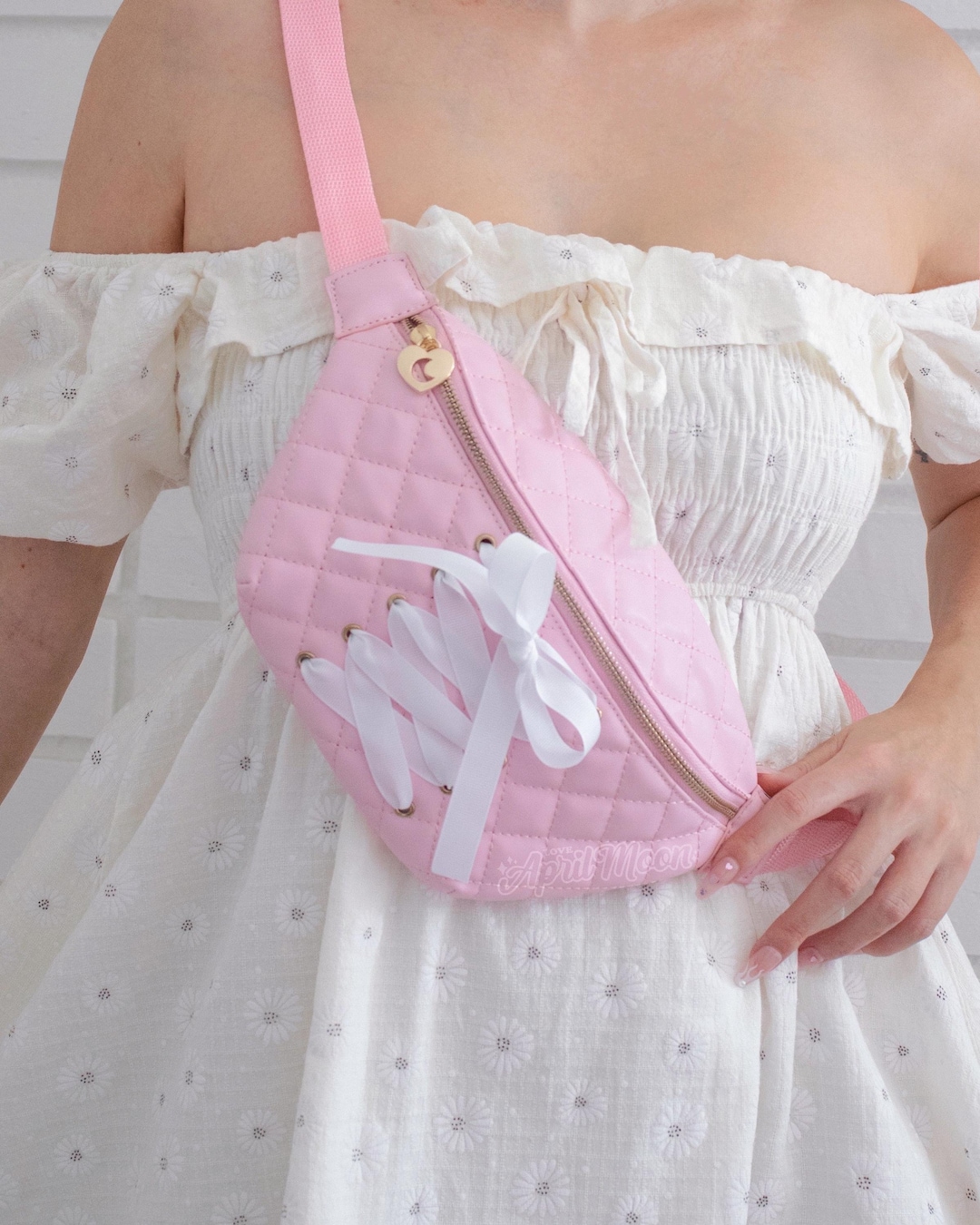 Pink Lillie Fanny Pack, quilted bag in pastel pink featuring lace up ribbon bow details, wear it crossbody or waist, coquette style, kawaii