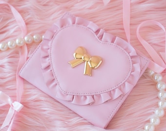 Pink Dahl Heart Wallet with ruffles and custom bow hardware, cottagecore, kawaii, and coquette style in vegan leather, black swan aesthetic