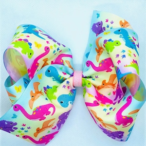 Rainbow Dinosaur Bow/ Dino bow/ dinosaurs/ cheer bow, boutique bow