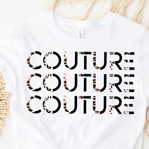 May include: White t-shirt with the word "COUTURE" repeated three times in black text. The text is layered over a leopard print pattern.