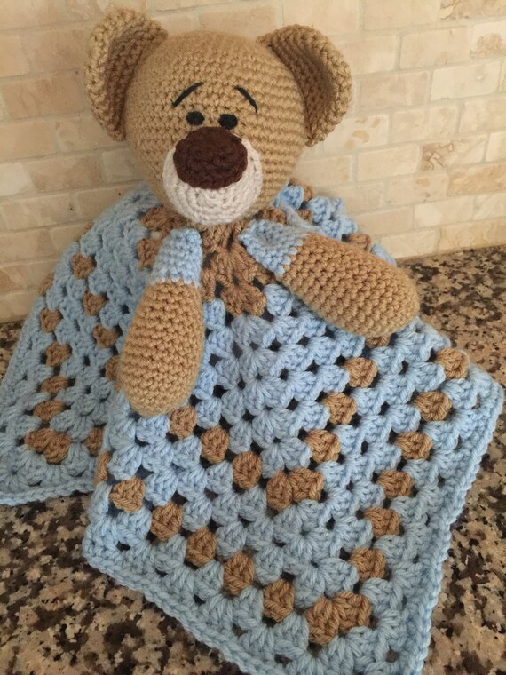 teddy bear with blanket attached