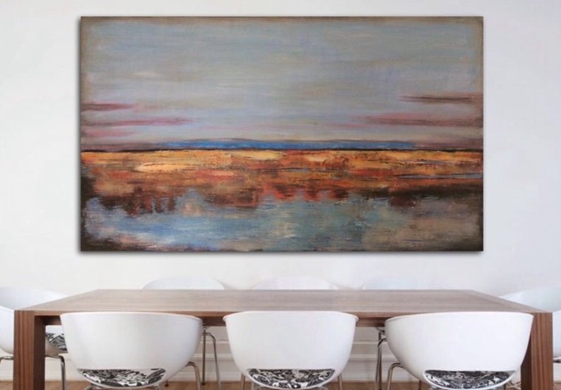 May include: Abstract landscape painting with a muted colour palette. The artwork features a sky with shades of blue and pink above a horizon of gold and brown tones. The lower portion reflects the sky and horizon in shades of blue and brown.