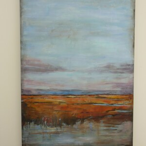 May include: Abstract landscape painting with a blue sky, brown and orange land, and a blue reflective water surface.