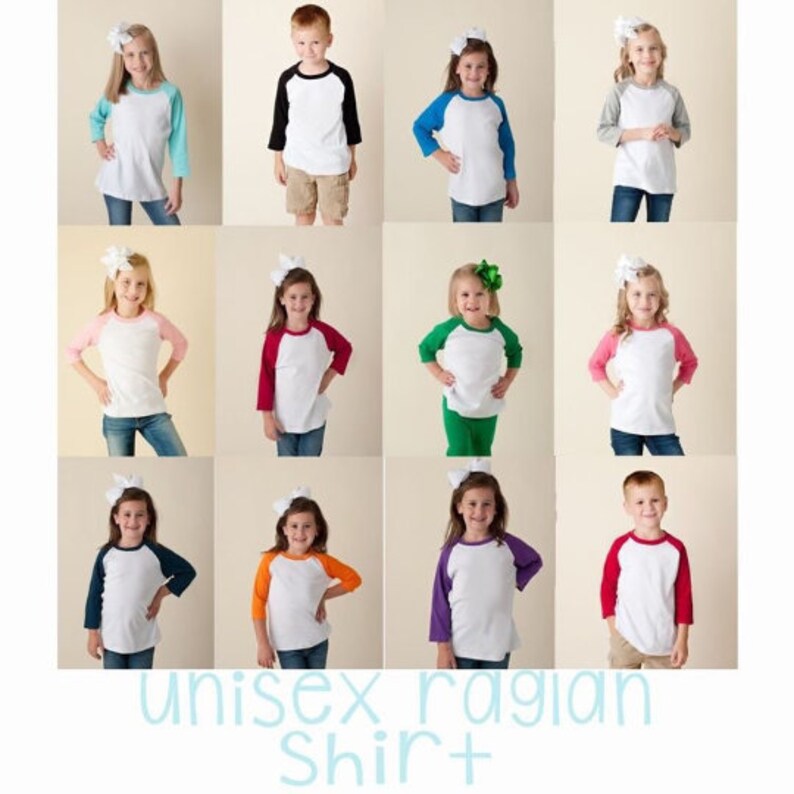 May include: A collection of 12 children's shirts in various colors. The shirts are all white with a colored raglan sleeve. The sleeves are in colors such as red, blue, green, orange, and black. The shirts are all unisex and are perfect for kids of all ages.