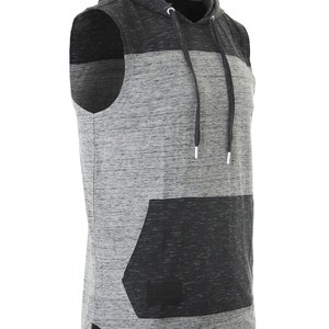 May include: A sleeveless hooded shirt with a gray and black color block design. The shirt has a kangaroo pocket on the front.