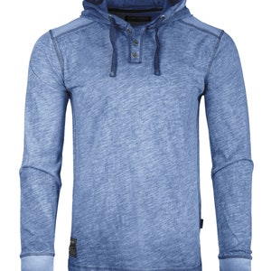 May include: A light blue long-sleeved hooded shirt with a button-up placket and a drawstring hood.