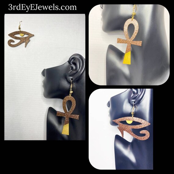 The Mixed Up Pair:  Eye of Heru paired with the Ankh, create these kemetic dangle earrings.