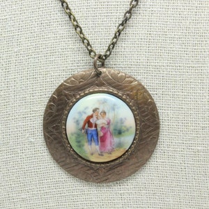 Vintage numbered C 423 transfer on porcelain rococo courting couple gold plate frame cameo pendant necklace