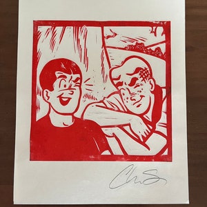 May include: Red and white linocut print of two men smiling and looking at each other. The print is signed "Chris" in the bottom right corner.