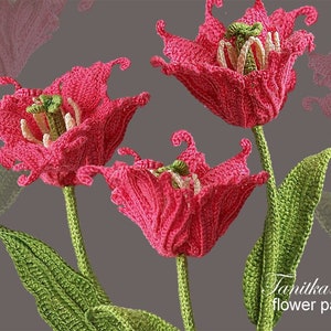 May include: Three handmade crochet flowers with pink petals, green stems, and leaves. The flowers have detailed textures and a realistic appearance. The image includes the text "Tanitka Lace flower pattern".