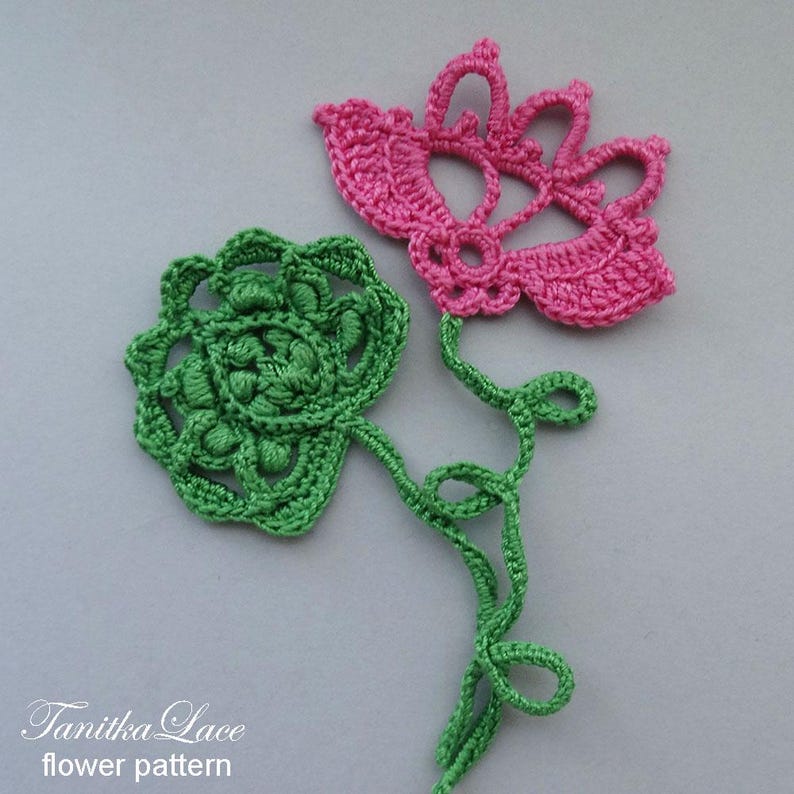 May include: Two crocheted flowers, one green and one pink, with green stems, against a gray background. The pink flower has a delicate, open design. The green flower is more compact. The text "Tanitka Lace flower pattern" is at the bottom.
