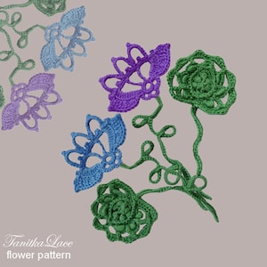 May include: Crocheted flower pattern in shades of blue, purple, and green. The flowers have intricate openwork designs and are connected by green stems. The text "Tanitka Lace flower pattern" is in the lower left corner.